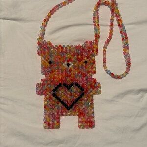 Bari Lynn rainbow beaded gummy bear bag
Crossbody strap